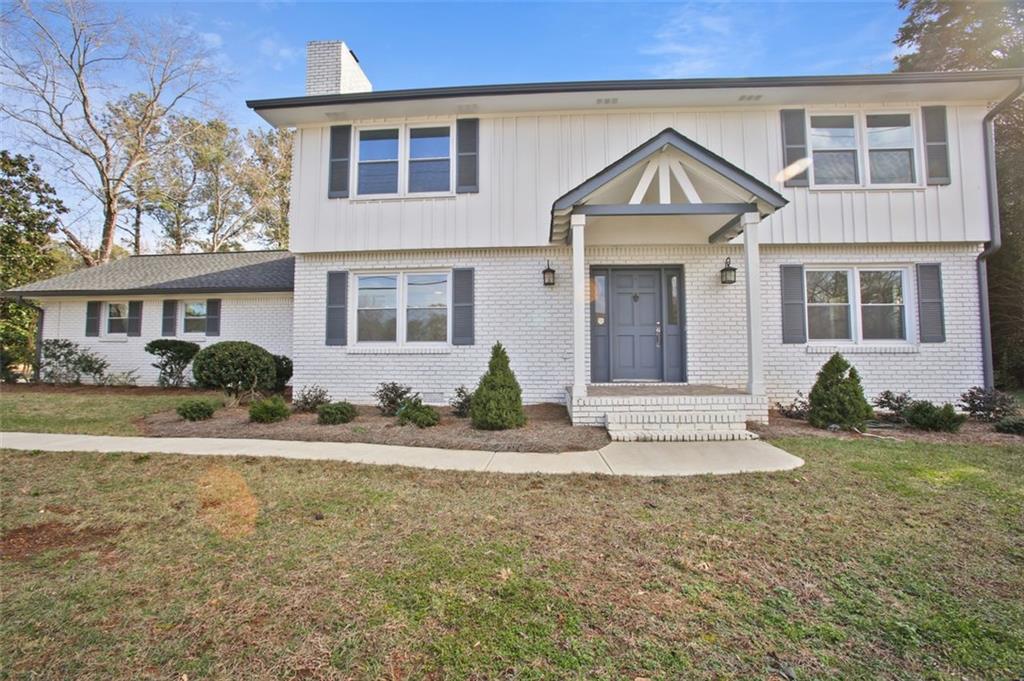 a front view of a house with garden