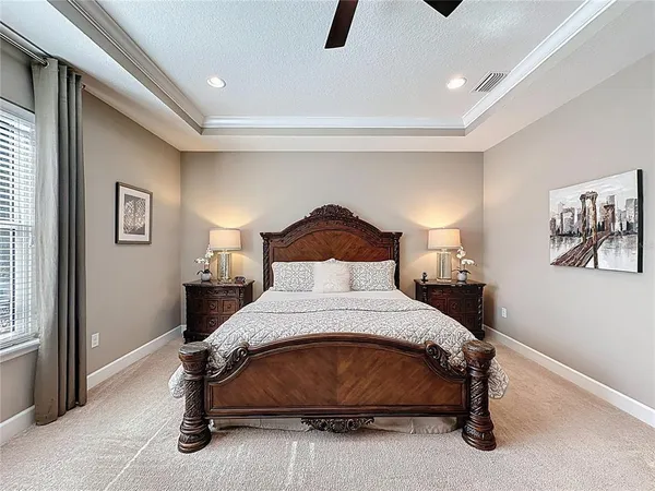 a bathroom with a granite countertop bathtub sink vanity and mirror
