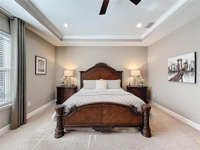 a bathroom with a granite countertop bathtub sink vanity and mirror