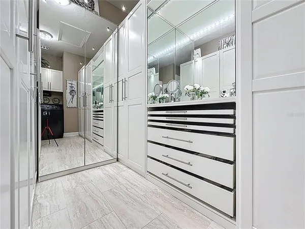 a bedroom with a bed and cabinets