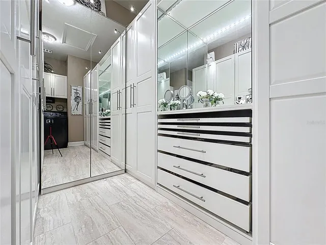 a bedroom with a bed and cabinets