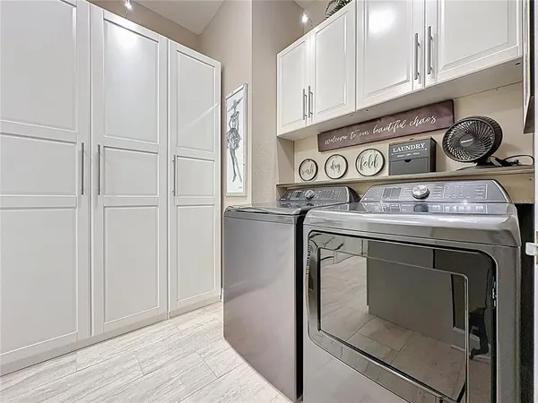 a en suite bathroom with a granite countertop sink and a mirror