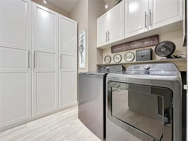 a en suite bathroom with a granite countertop sink and a mirror