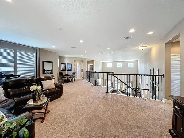 a living room with furniture rug and window