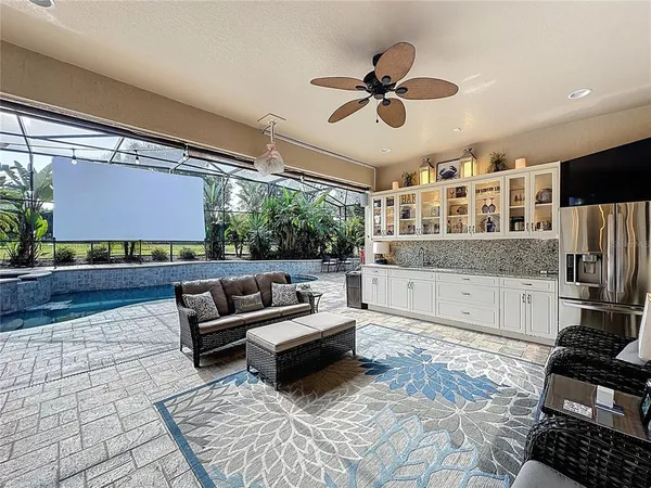 a kitchen with stainless steel appliances granite countertop a sink and wooden cabinets