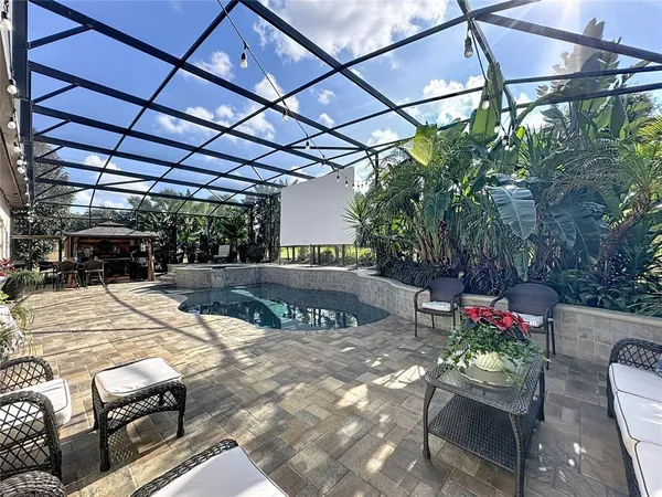 a view of a lake with couches in the patio