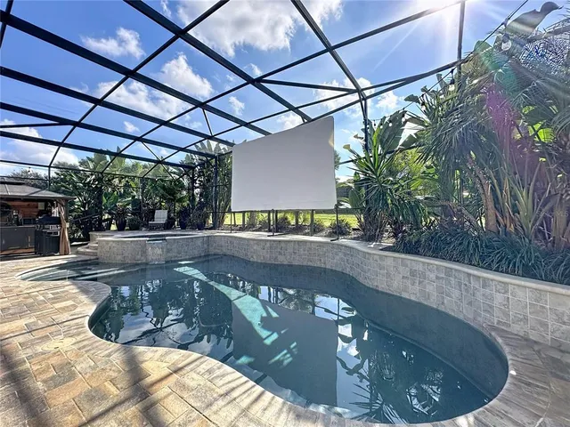 an aerial view of a house with a lake view