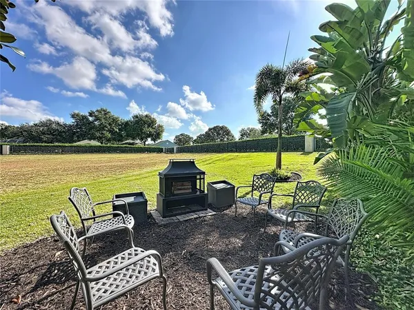 an aerial view of a house with garden space and lake view