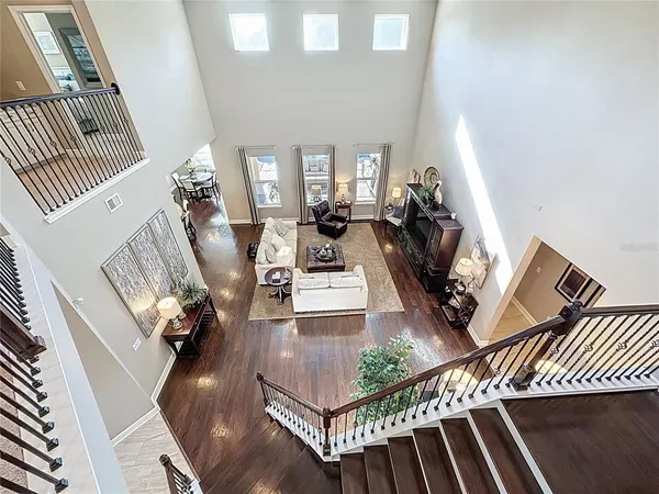 a view of living room with furniture and wooden floor