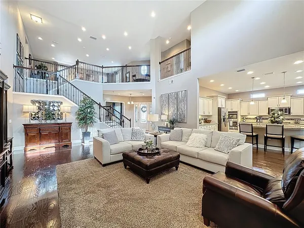 a living room with furniture or kitchen view and a wooden floor