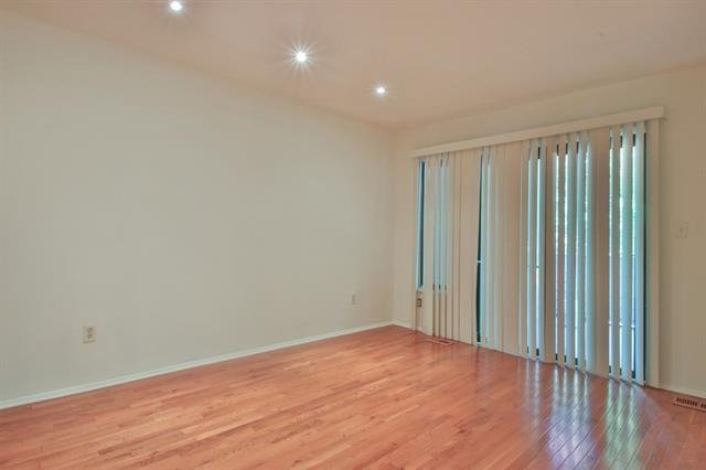 700 Mainsail Lane, Unit 700 Secaucus, NJ 07094 - Photo 11 of 28 a view of empty room with wooden floor and fan