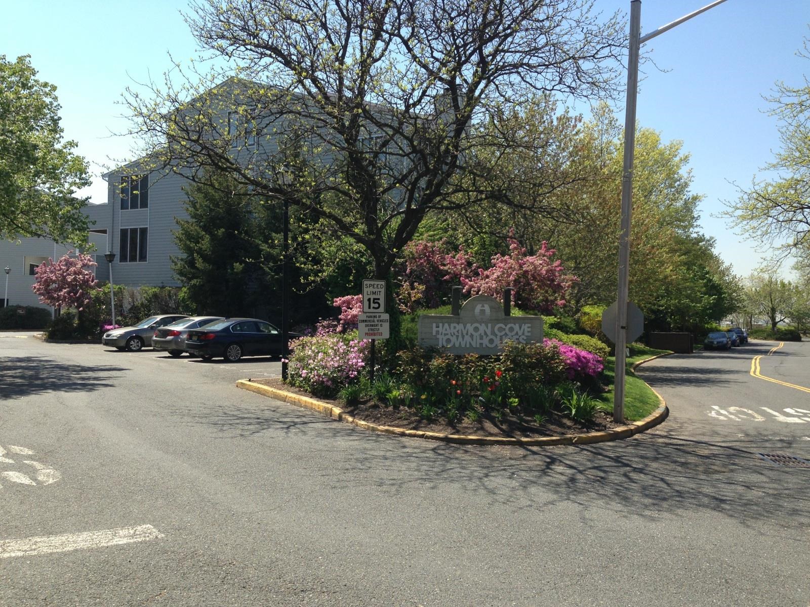700 Mainsail Lane, Unit 700 Secaucus, NJ 07094 - Photo 15 of 28 a street view with a bench and trees