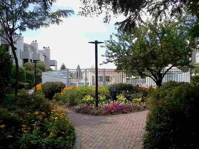 700 Mainsail Lane, Unit 700 Secaucus, NJ 07094 - Photo 16 of 28 a view of a garden with a fountain and plants