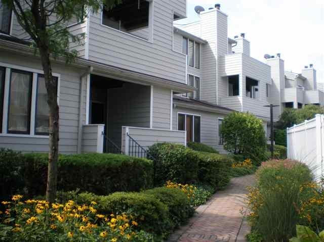 700 Mainsail Lane, Unit 700 Secaucus, NJ 07094 - Photo 23 of 28 a front view of a house with a yard