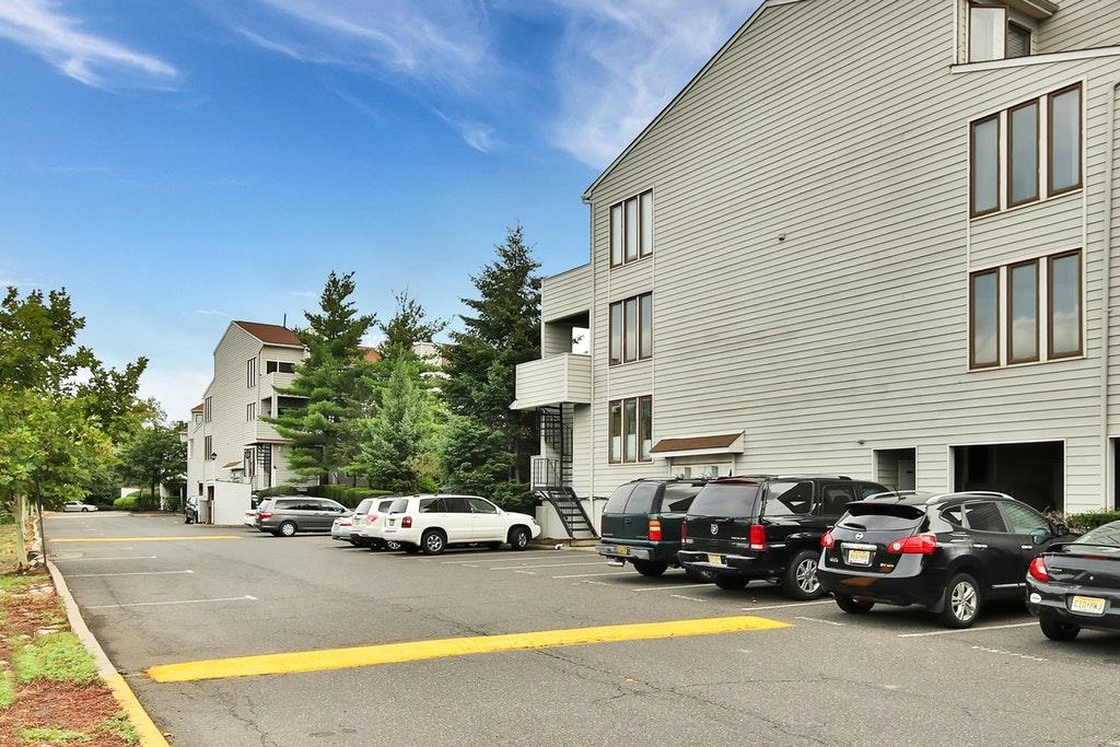 700 Mainsail Lane, Unit 700 Secaucus, NJ 07094 - Photo 24 of 28 a car parked in front of a house