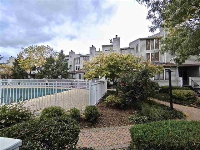 700 Mainsail Lane, Unit 700 Secaucus, NJ 07094 - Photo 25 of 28 a view of a garden with wooden fence