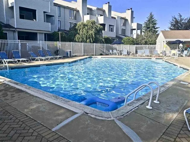 a view of a swimming pool with a patio
