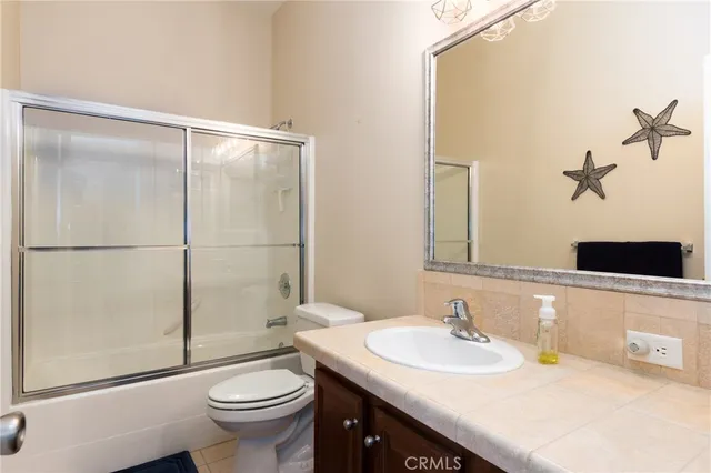 a bed sitting in a room next to a window