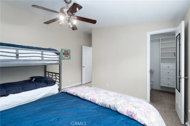 a view of a roof deck with table and chairs and wooden floor