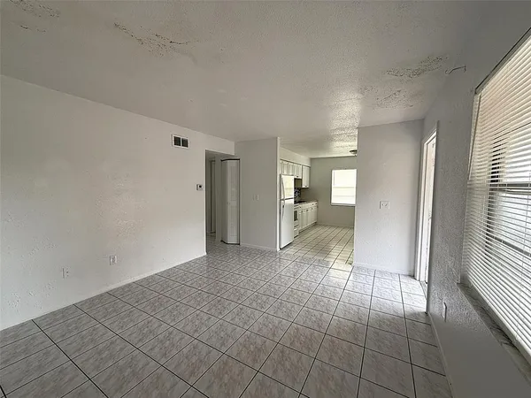 an empty room with a natural light