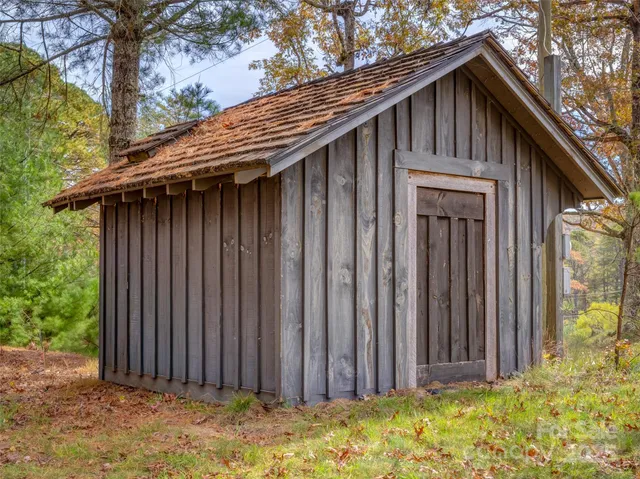 a view of backyard with large trees