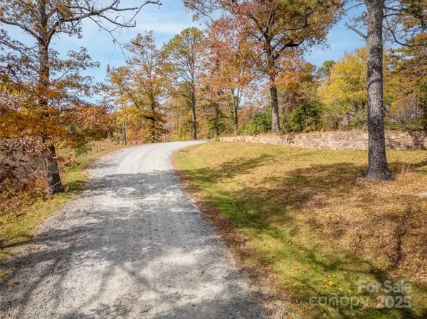 a view of yard covered with snow in front of house