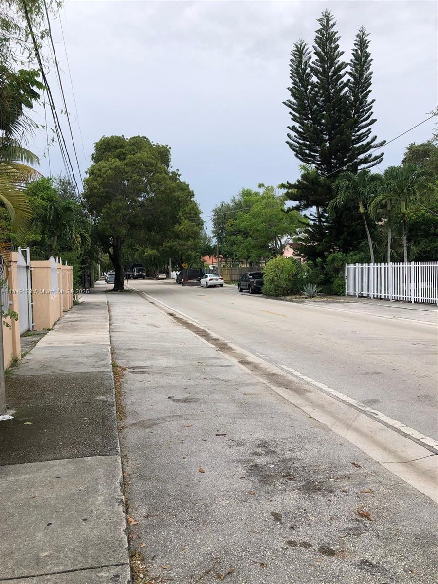 560 Northeast 69th Street, Unit 1 Miami, FL 33138 - Photo 21 of 23 a backyard of a house with lots of green space