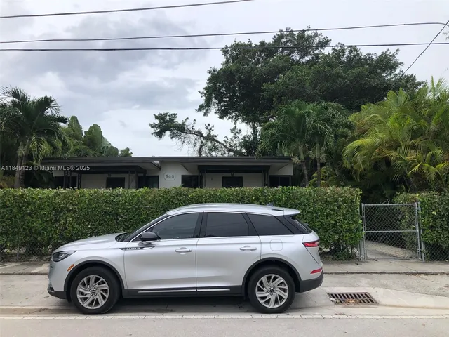 a car parked in front of a house