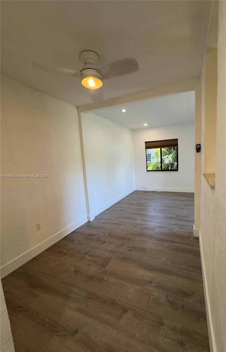 560 Northeast 69th Street, Unit 1 Miami, FL 33138 - Photo 9 of 23 an empty room with a empty space and windows