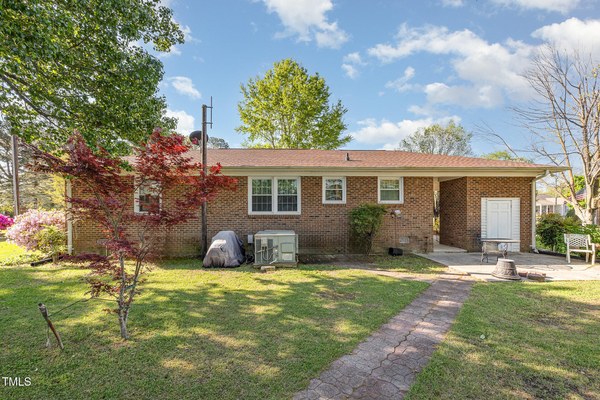 1108 Friendly Road Dunn, NC 28334 - Photo 14 of 17 a house view with swimming pool and garden