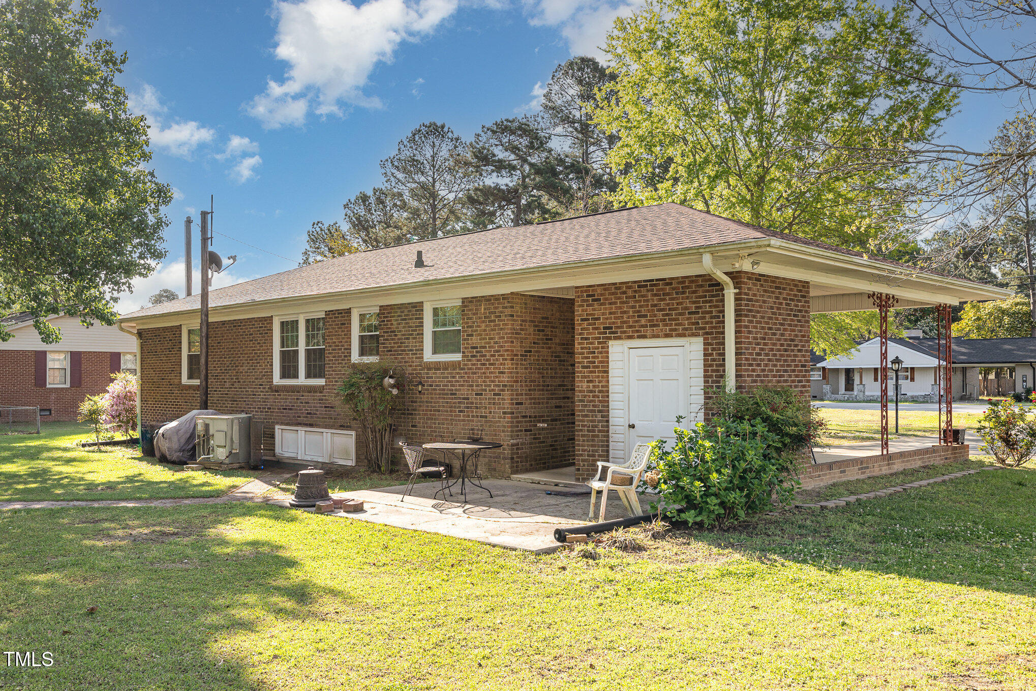 1108 Friendly Road Dunn, NC 28334 - Photo 15 of 17 a view of a house with swimming pool and a yard
