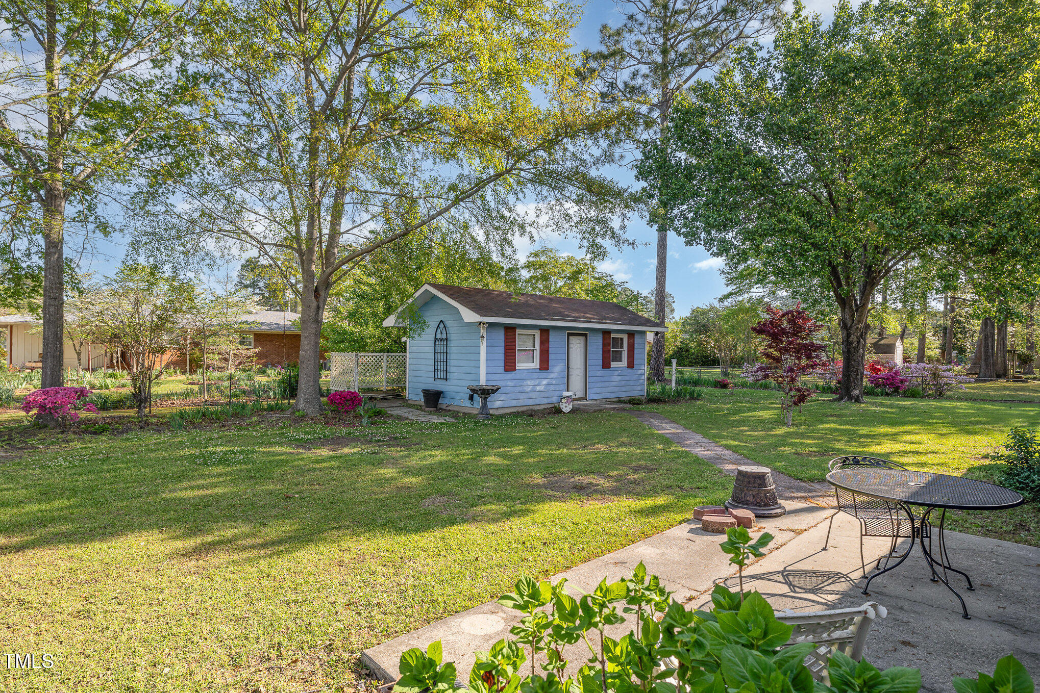 1108 Friendly Road Dunn, NC 28334 - Photo 16 of 17 a view of a house with a yard
