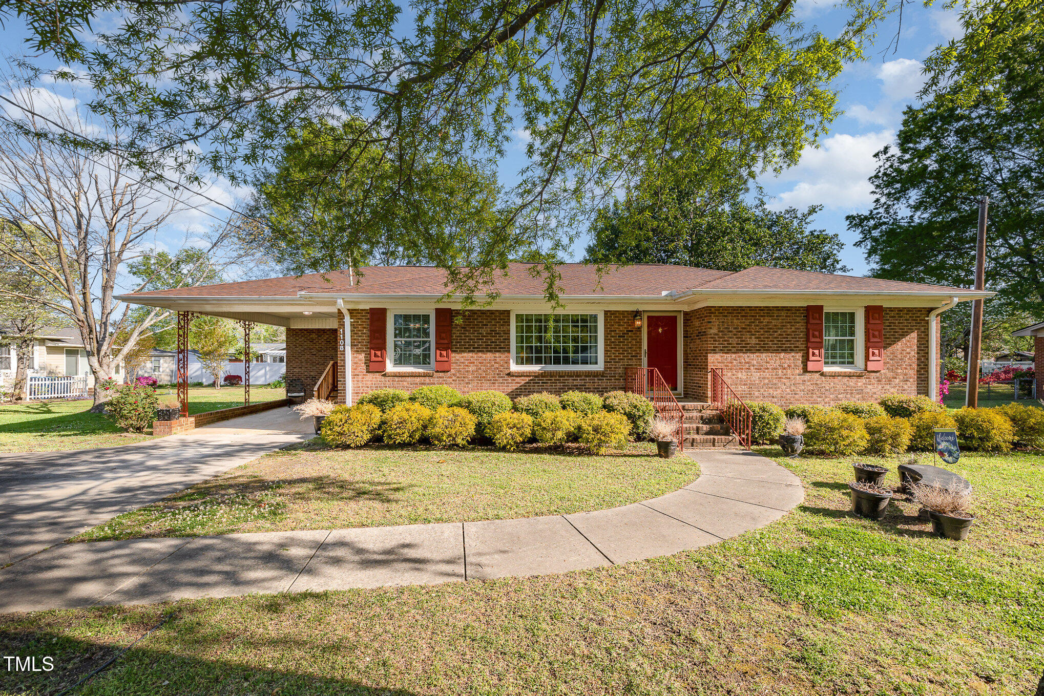 1108 Friendly Road Dunn, NC 28334 - Photo 2 of 17 a front view of a house with a patio