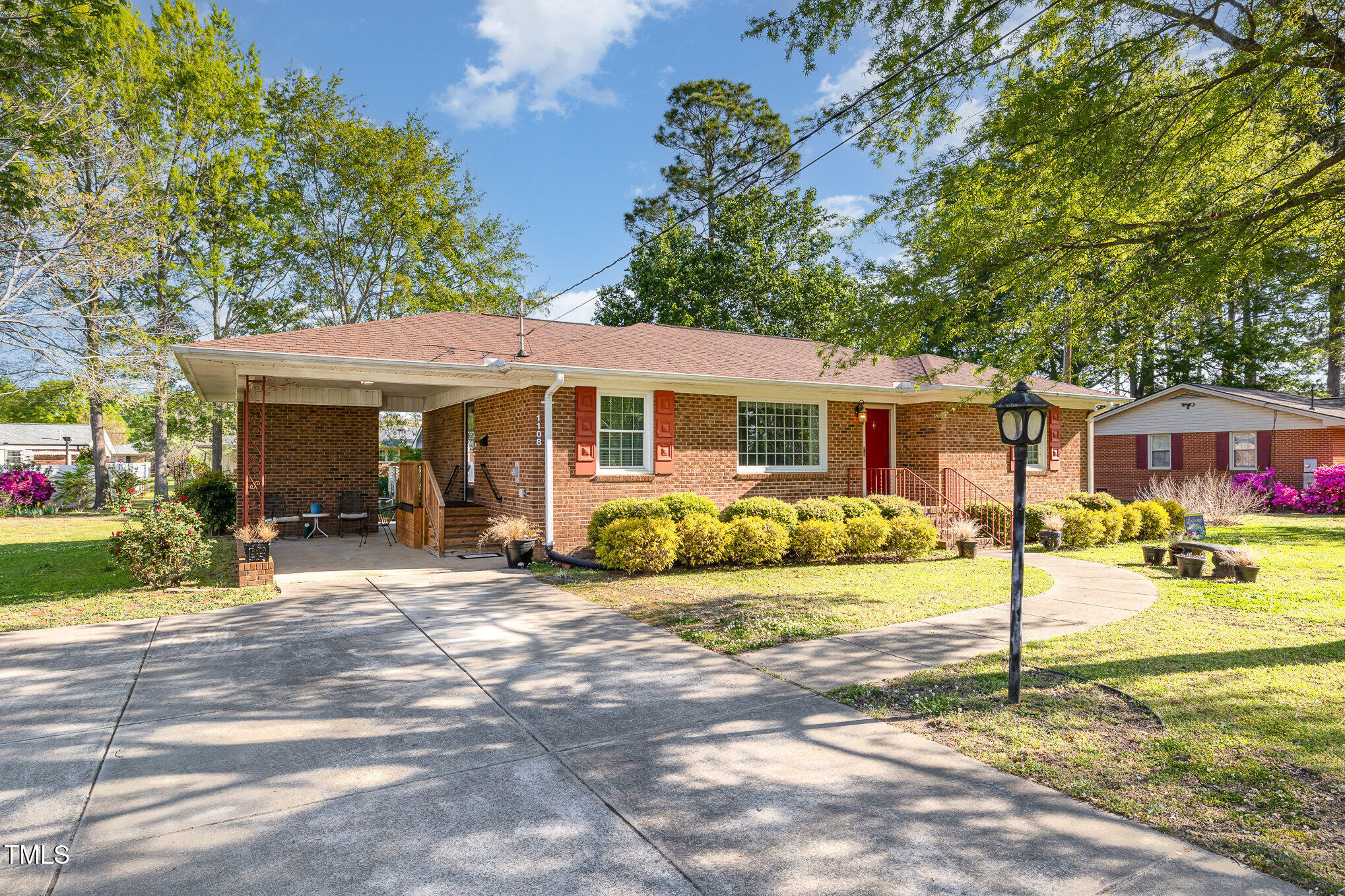 1108 Friendly Road Dunn, NC 28334 - Photo 3 of 17 a front view of a house with a yard