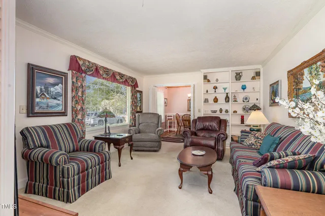 a living room with furniture or couch and a large window