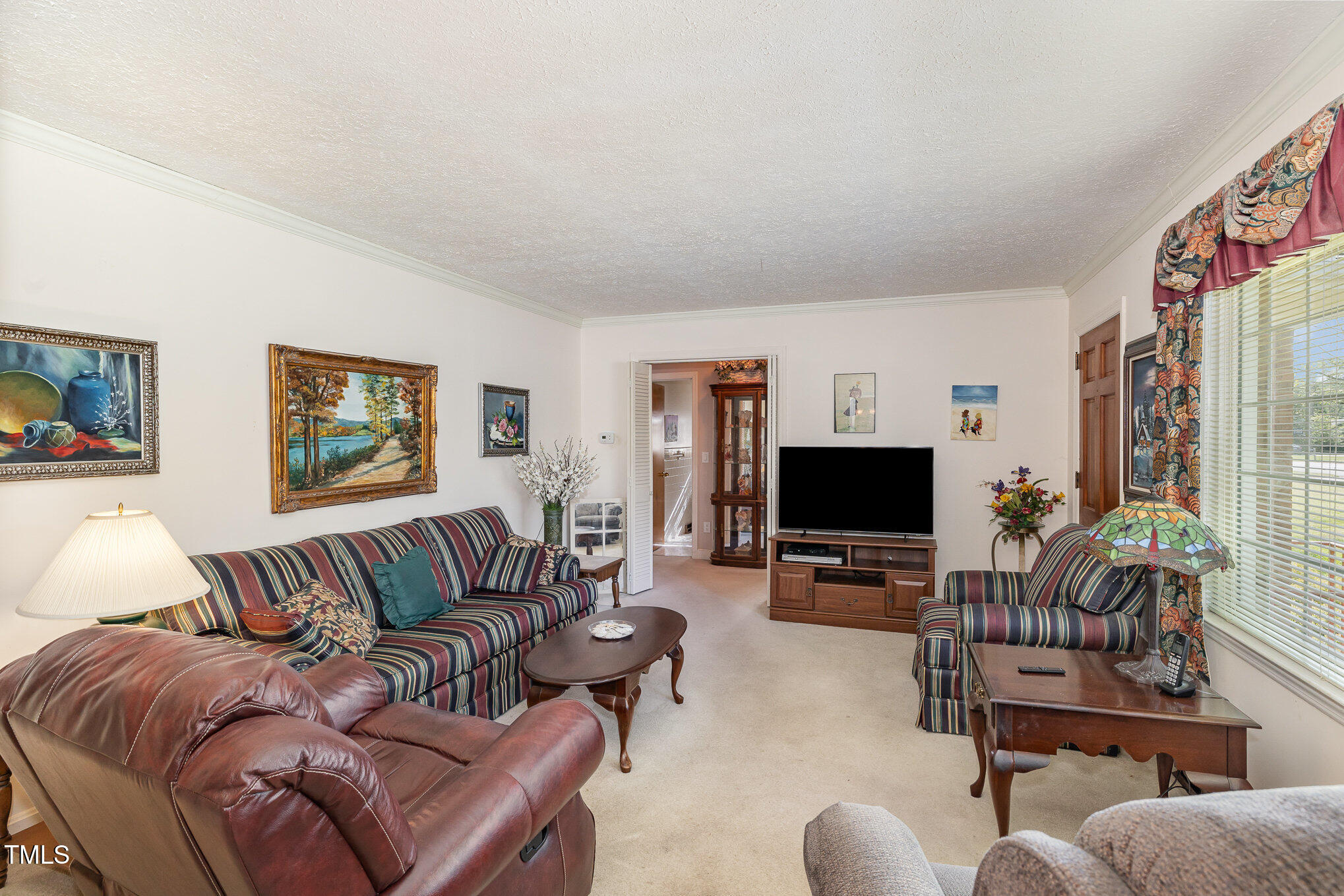 1108 Friendly Road Dunn, NC 28334 - Photo 7 of 17 a living room with furniture and a flat screen tv