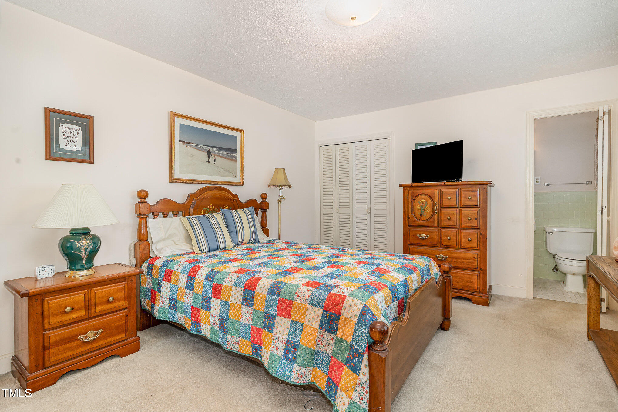 1108 Friendly Road Dunn, NC 28334 - Photo 8 of 17 a bedroom with a bed and furniture