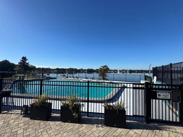 a view of a roof deck with wooden floor and fence
