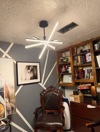 a room with furniture and book shelf