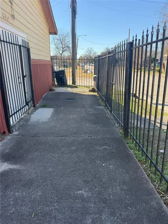 a view of a porch with wooden fence