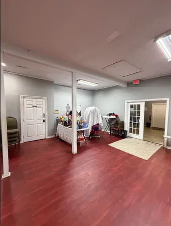a view of a livingroom with furniture and a garage