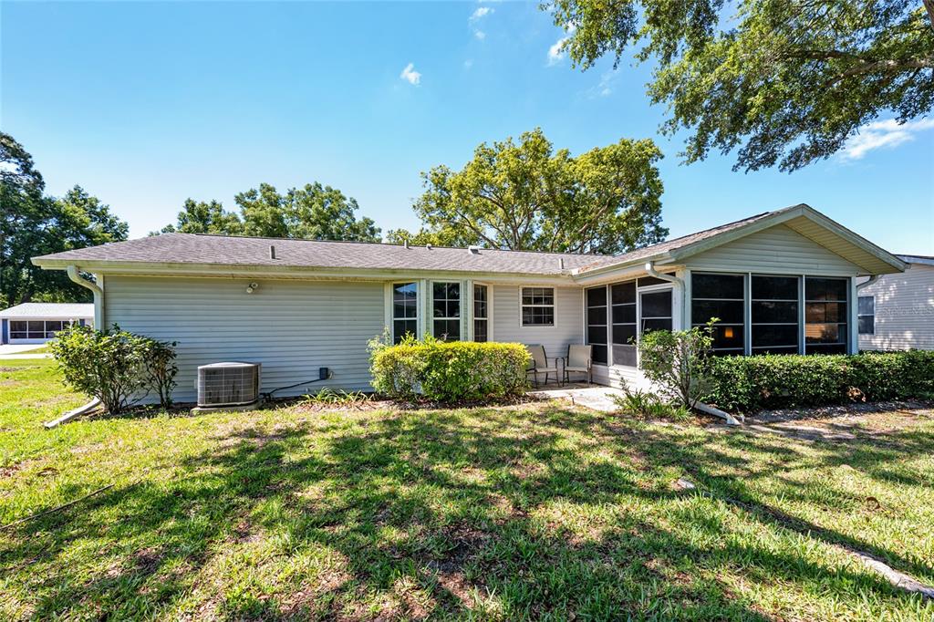 8038 Southwest 108th Loop Ocala, FL 34481 - Photo 33 of 48 front view of a house with a yard