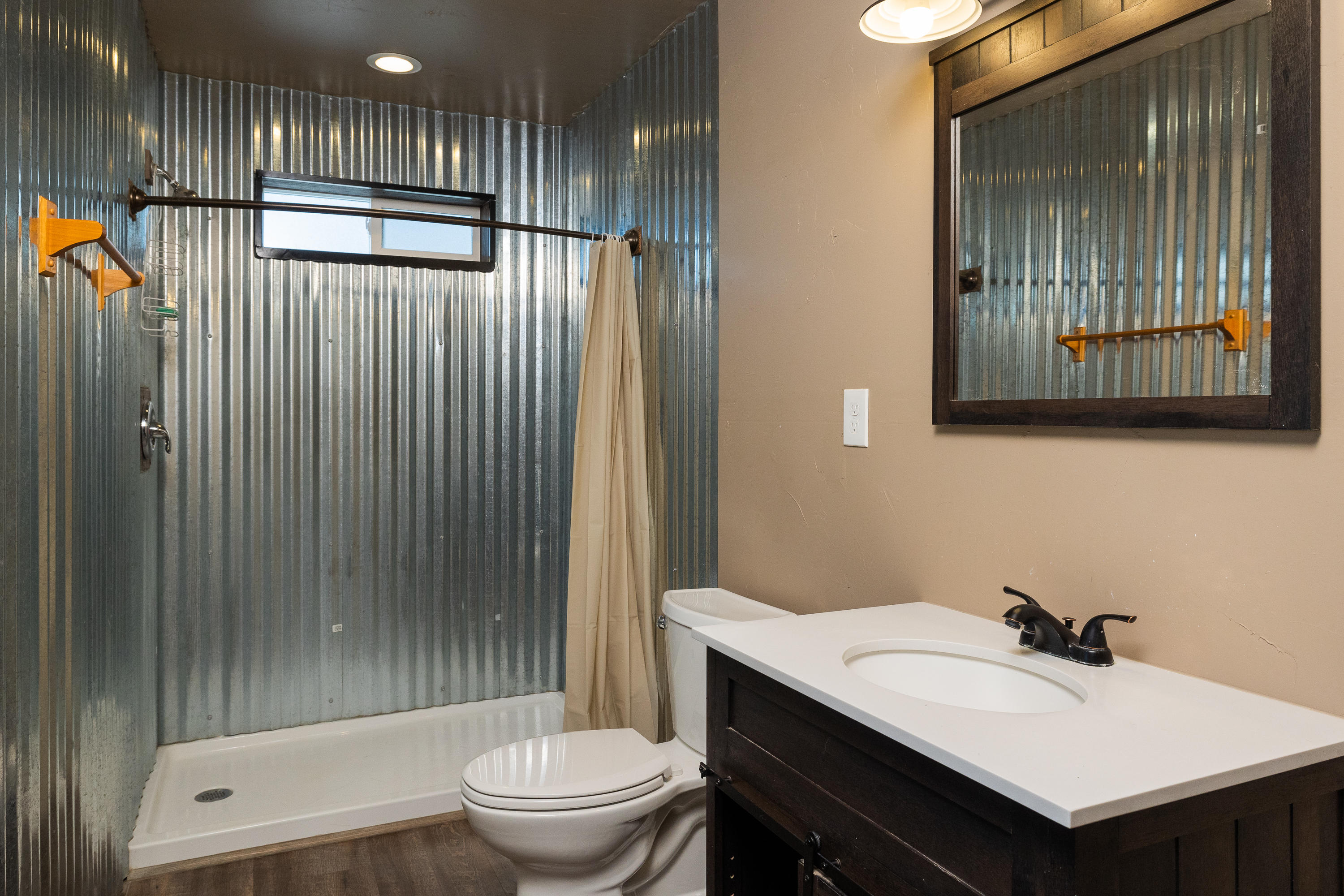 61822 Ten Barr Ranch Road Bend, OR 97701 - Photo 32 of 50 a bathroom with a sink toilet and shower