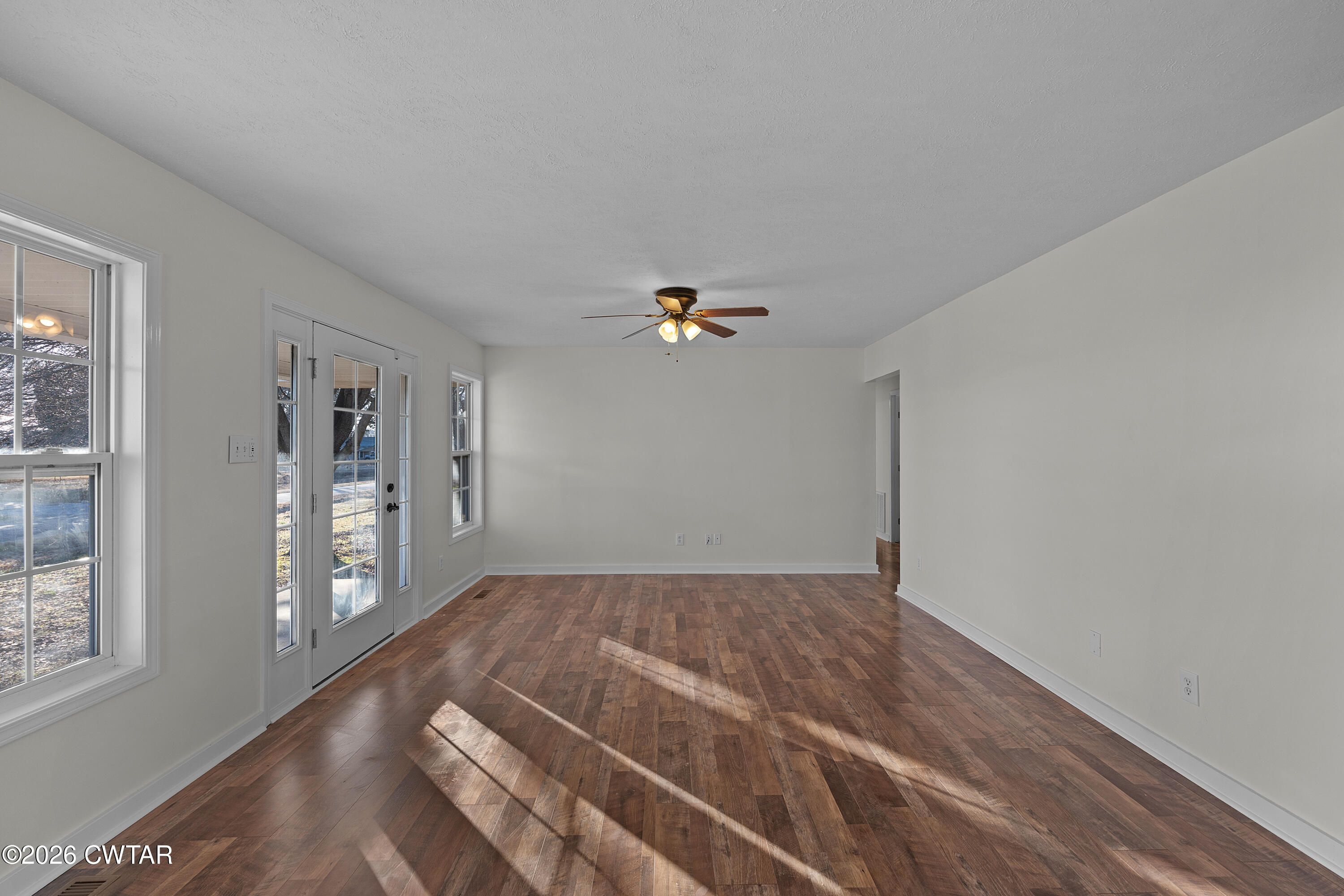 244 Loop Road Trenton, TN 38382 - Photo 15 of 25 wooden floor in an empty room with a window