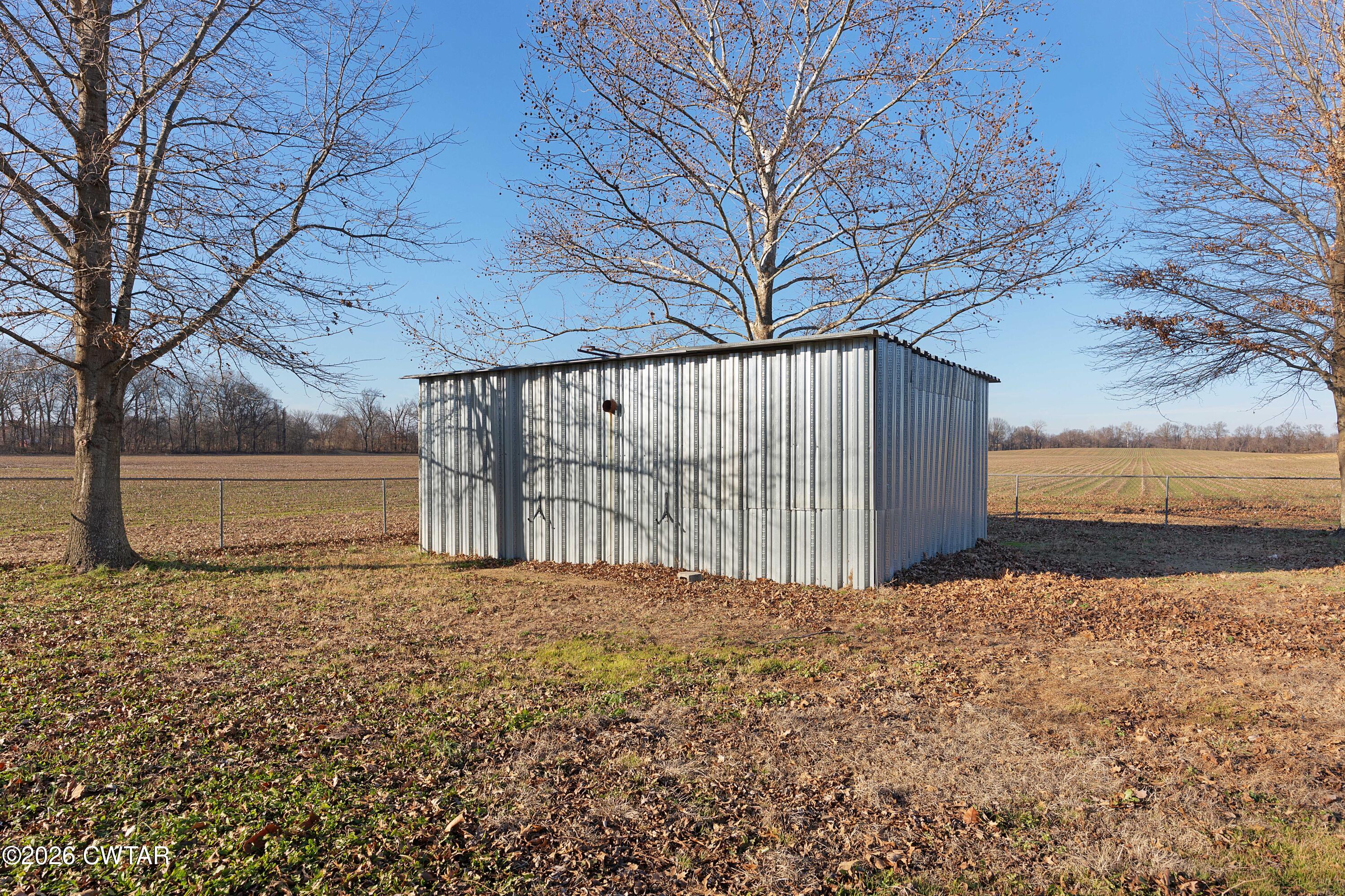 244 Loop Road Trenton, TN 38382 - Photo 7 of 25 a view of a backyard of house