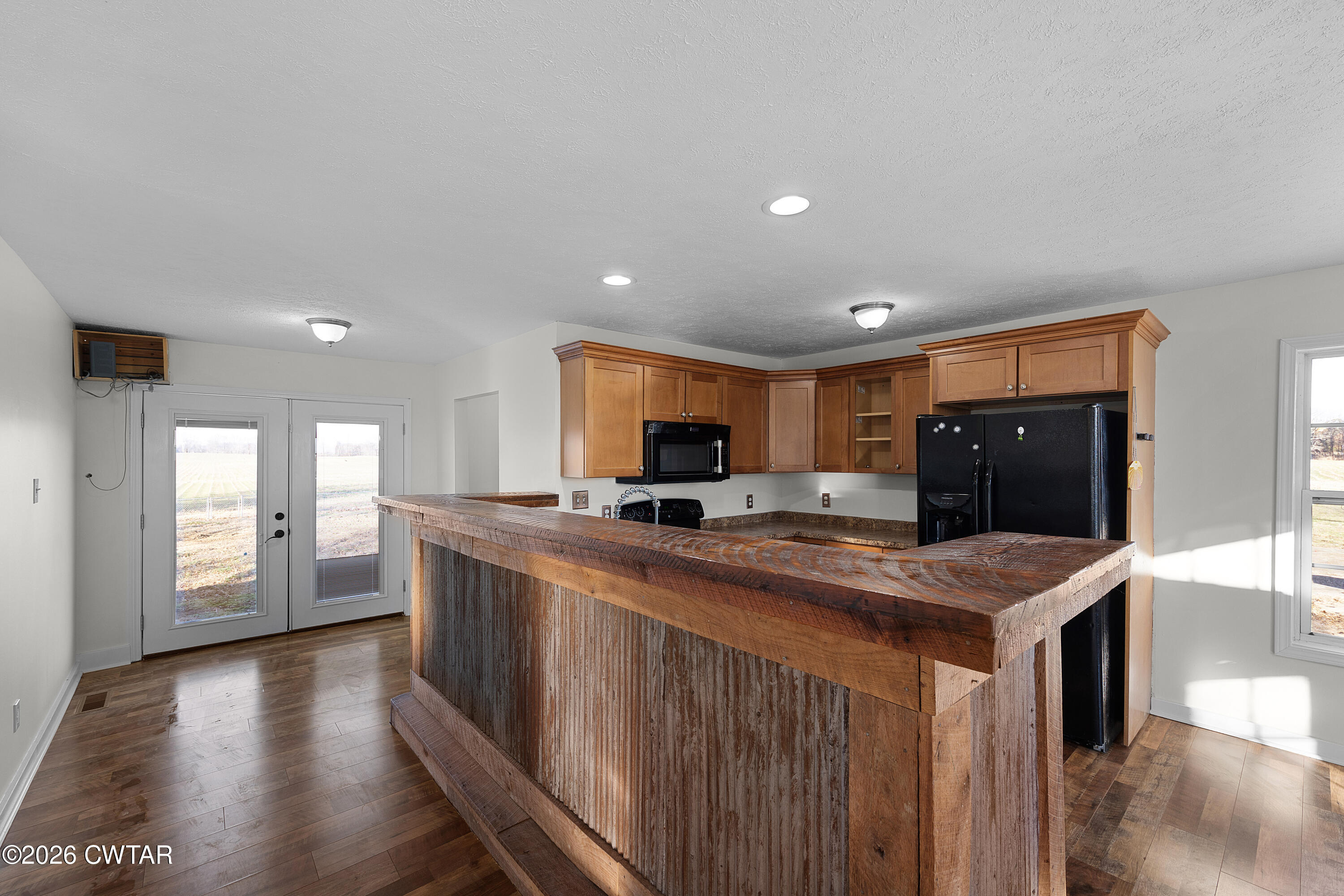 244 Loop Road Trenton, TN 38382 - Photo 10 of 25 a kitchen with stainless steel appliances granite countertop a stove a sink and a refrigerator