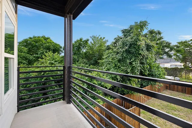 a view of a balcony with plants