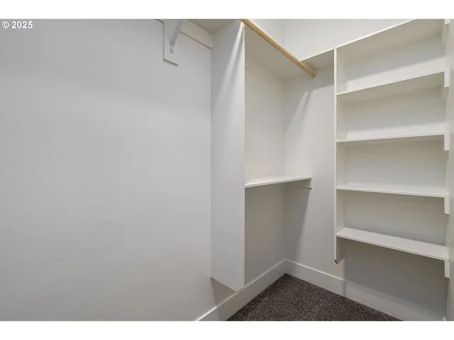a view of an empty walk in closet