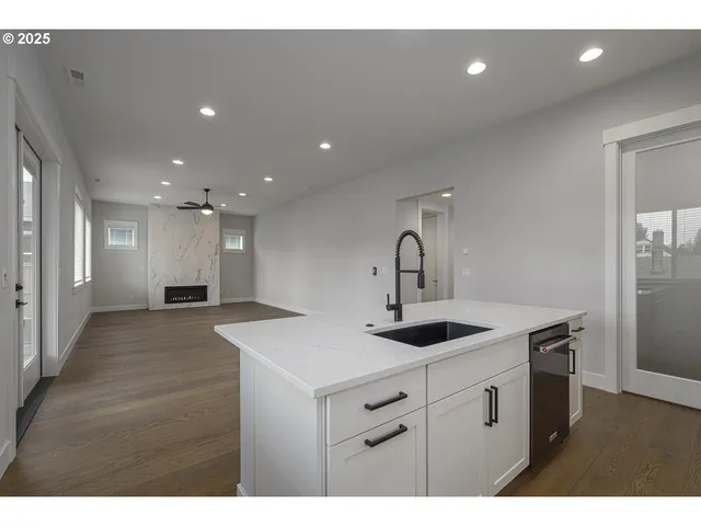 a kitchen with a sink and a refrigerator