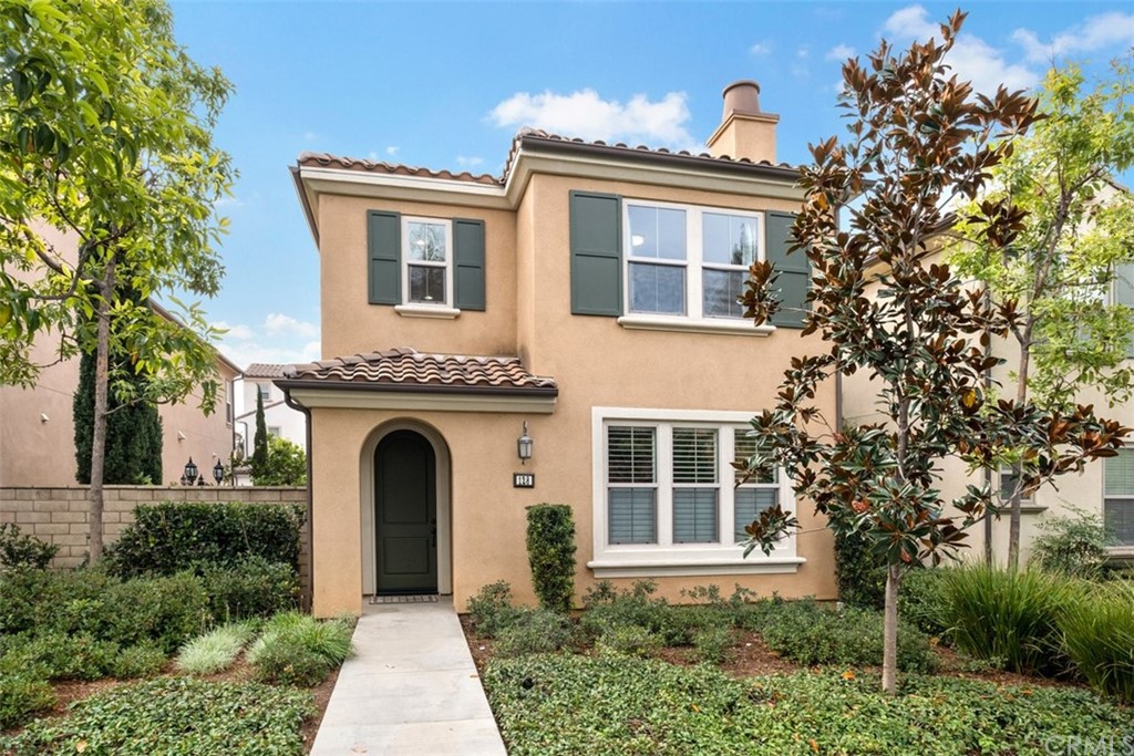 128 Long Grass Irvine, CA 92618 - Photo 2 of 42 front view of a house with a garden